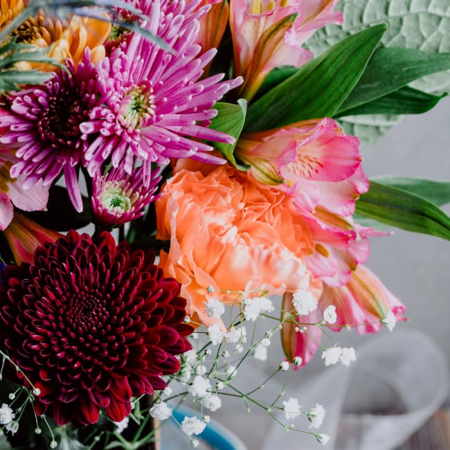 A vase of colorful assorted flowers